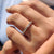 Round and baguette diamond wedding band with sparkling stones.
