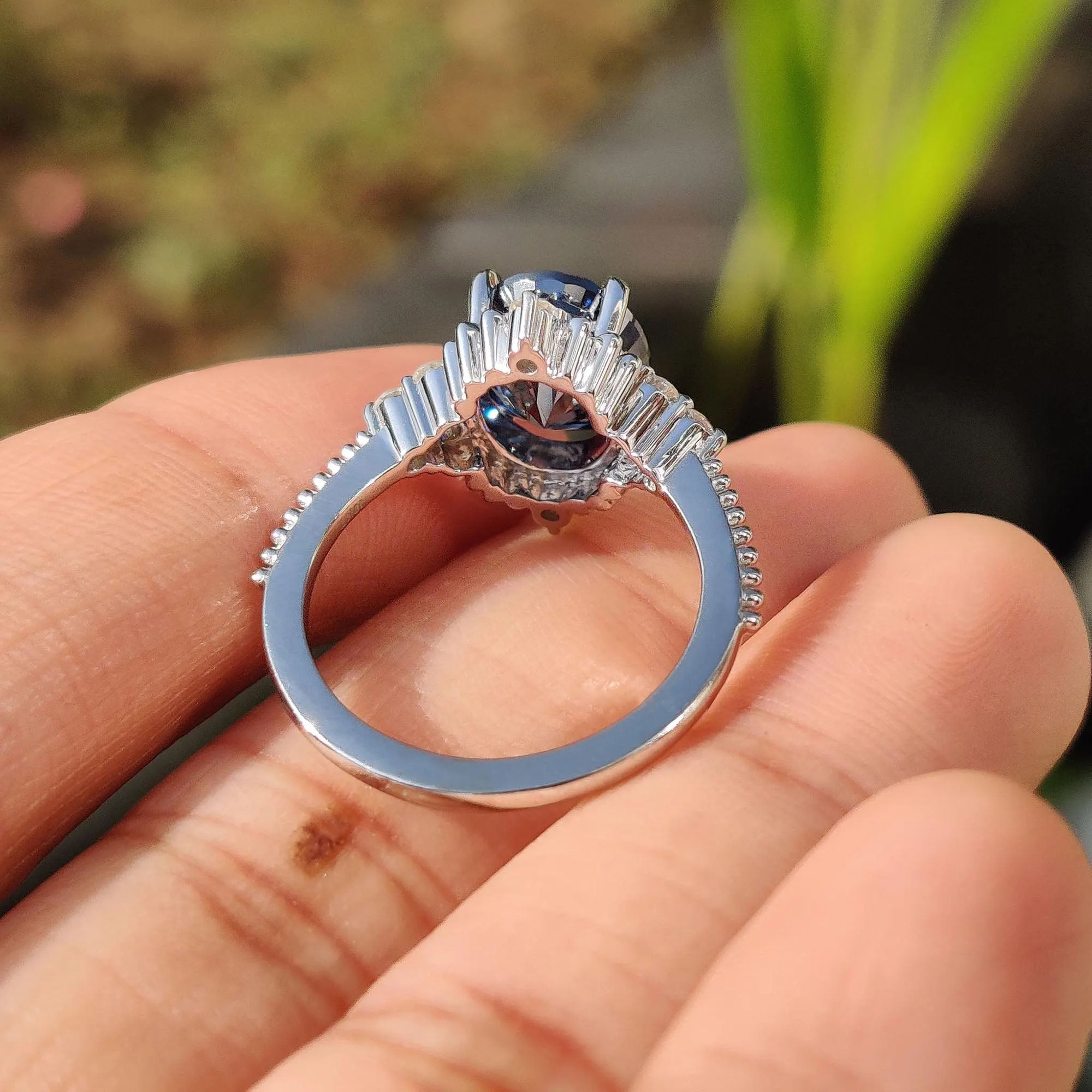 Round cut side stones highlight the center with balance and light.
