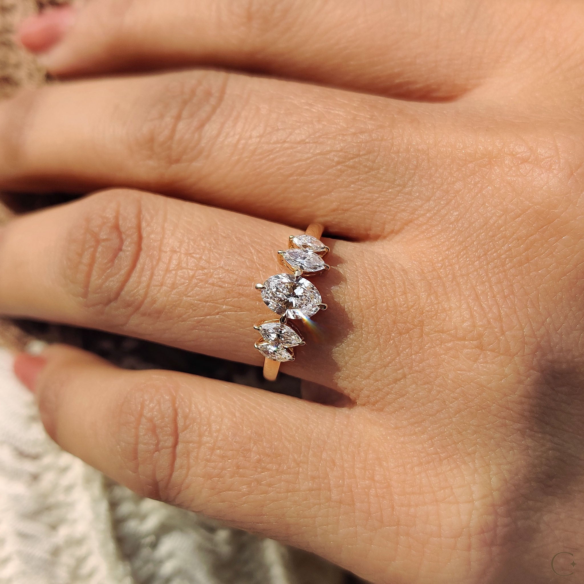 Five stone diamond ring set in yellow gold.
