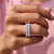Shared prong wedding band securely holds each stone.