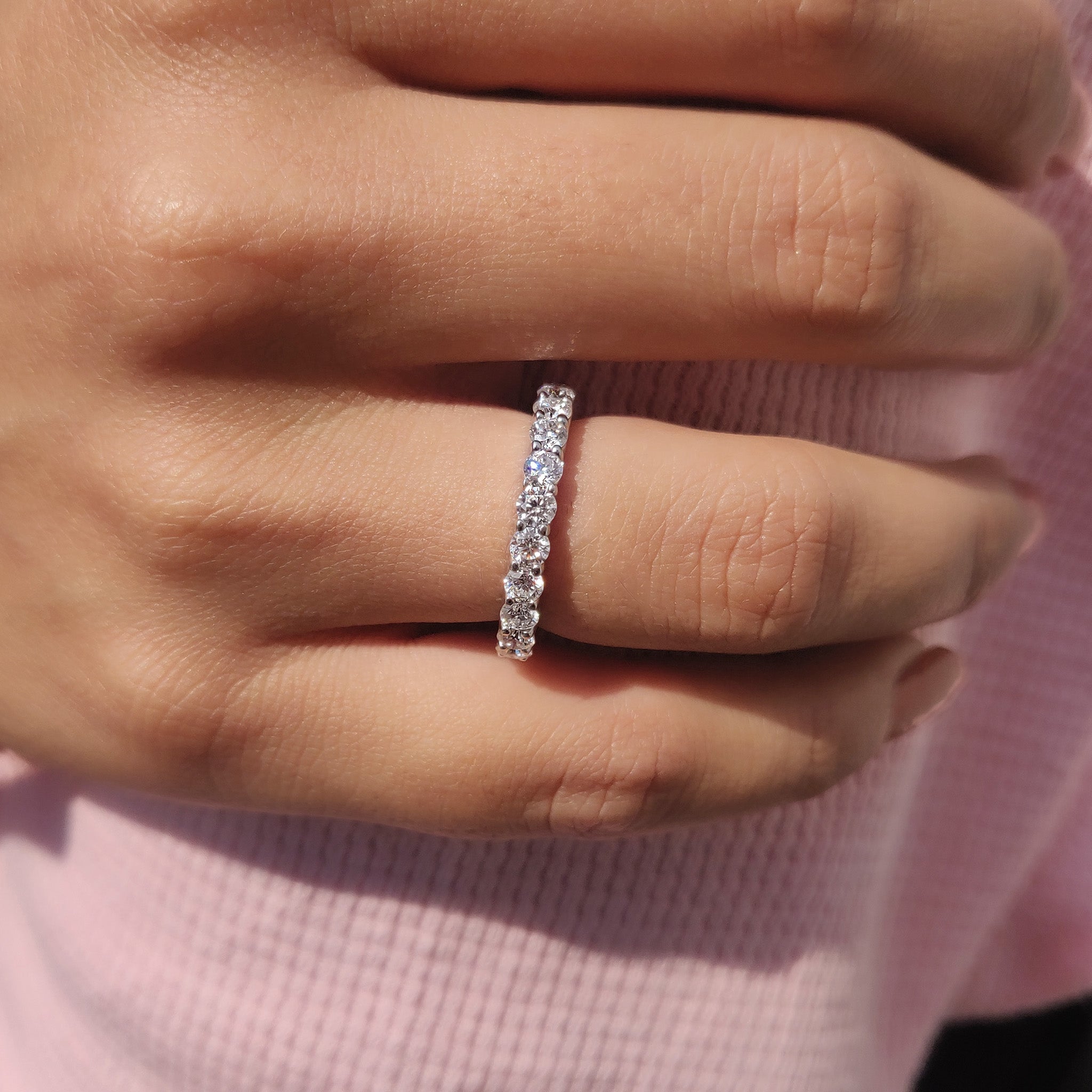 Round cut wedding band enhances full eternity wedding band.
