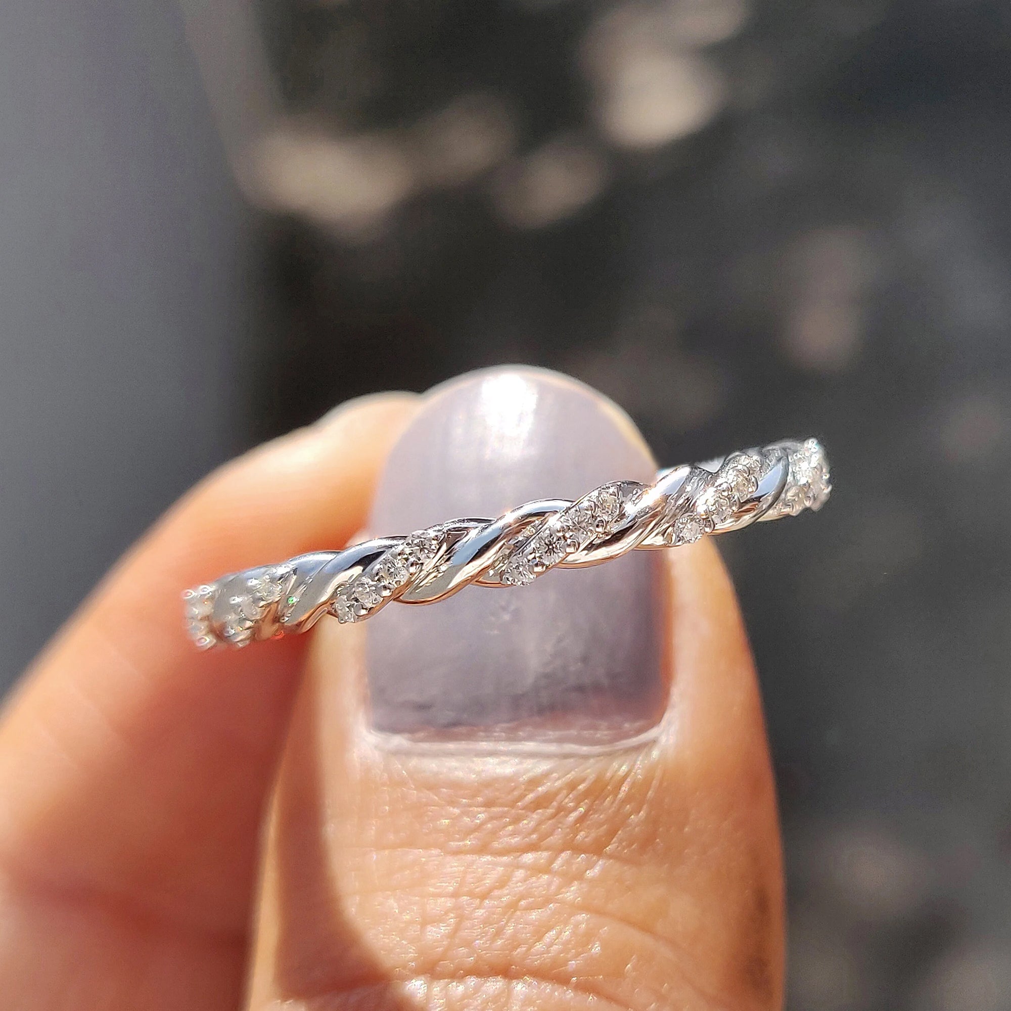 Custom moissanite band in a unique twist style
