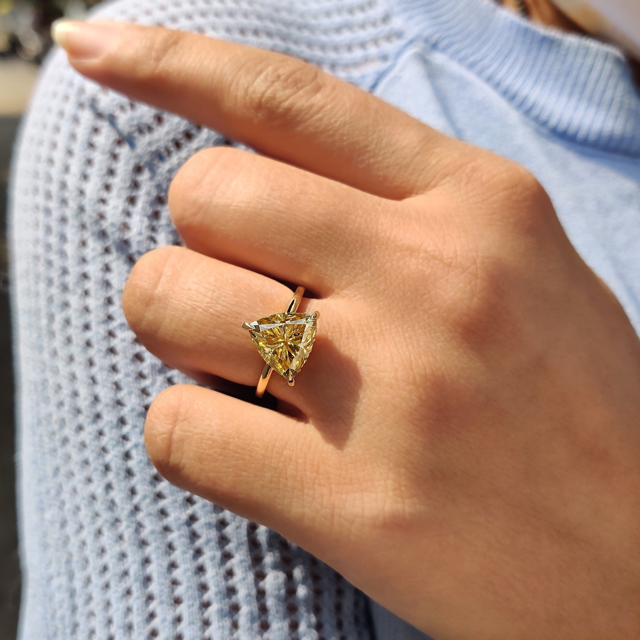 Buy engagement ring with a round cut hidden halo setting for added brilliance.