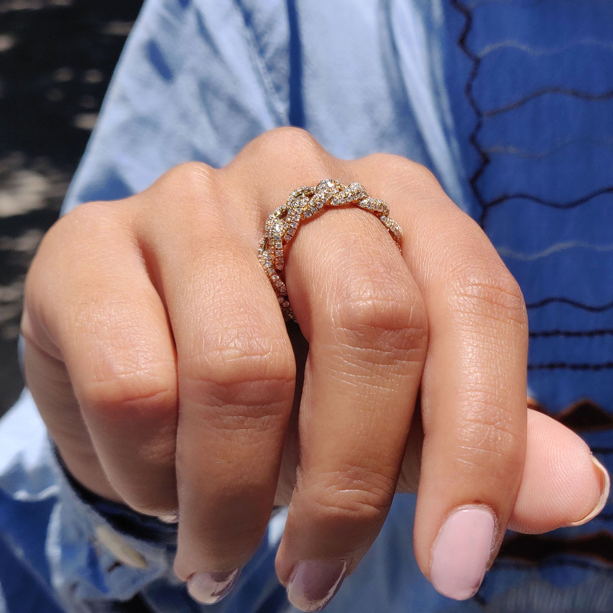 Custom wedding band with a unique handmade design, crafted in yellow gold.