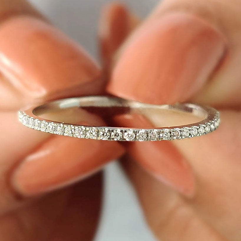 Minimalist wedding band in sleek white gold for modern brides.
