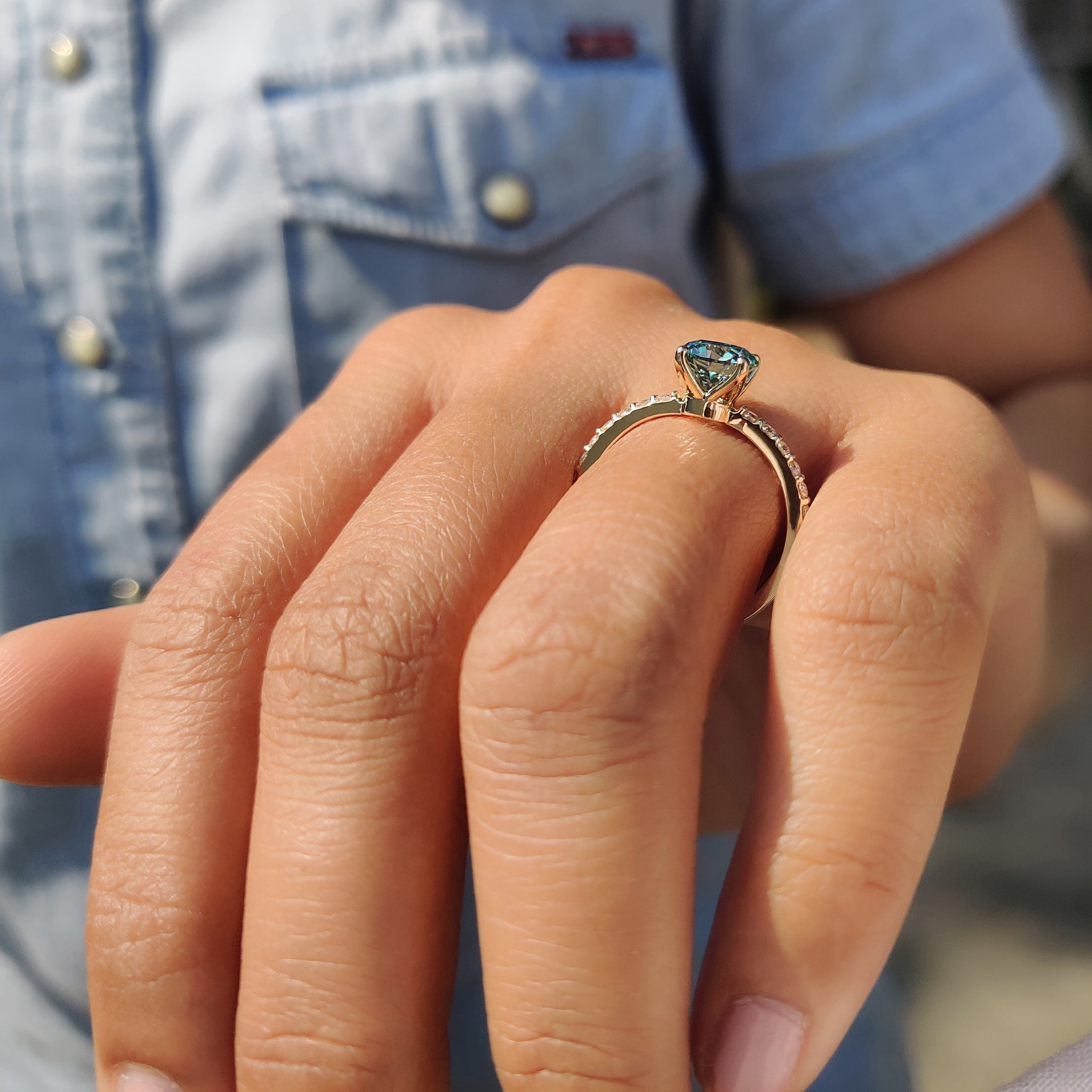 A round cut engagement ring with pave setting makes a smart and stylish choice.
