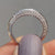 Knife edge wedding band with sleek, sharp edges.