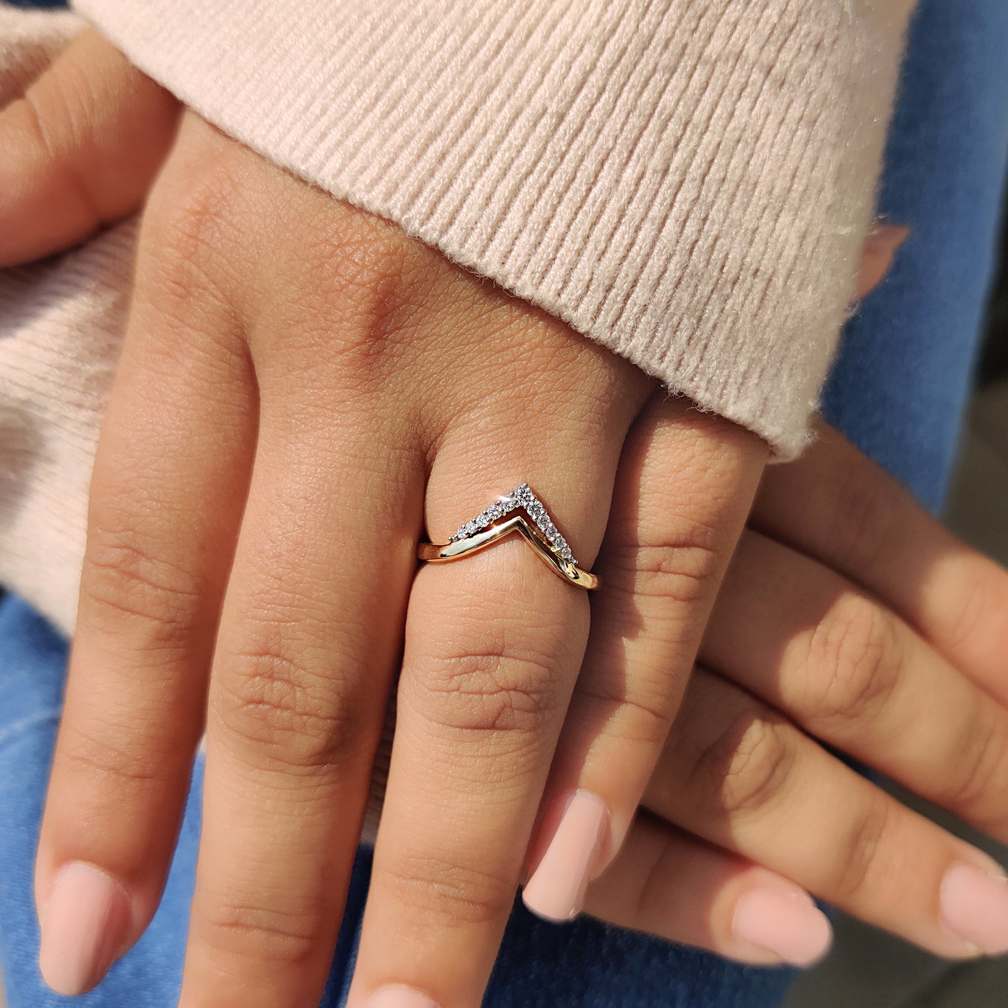 Round moissanite wedding band with sparkling stones.
