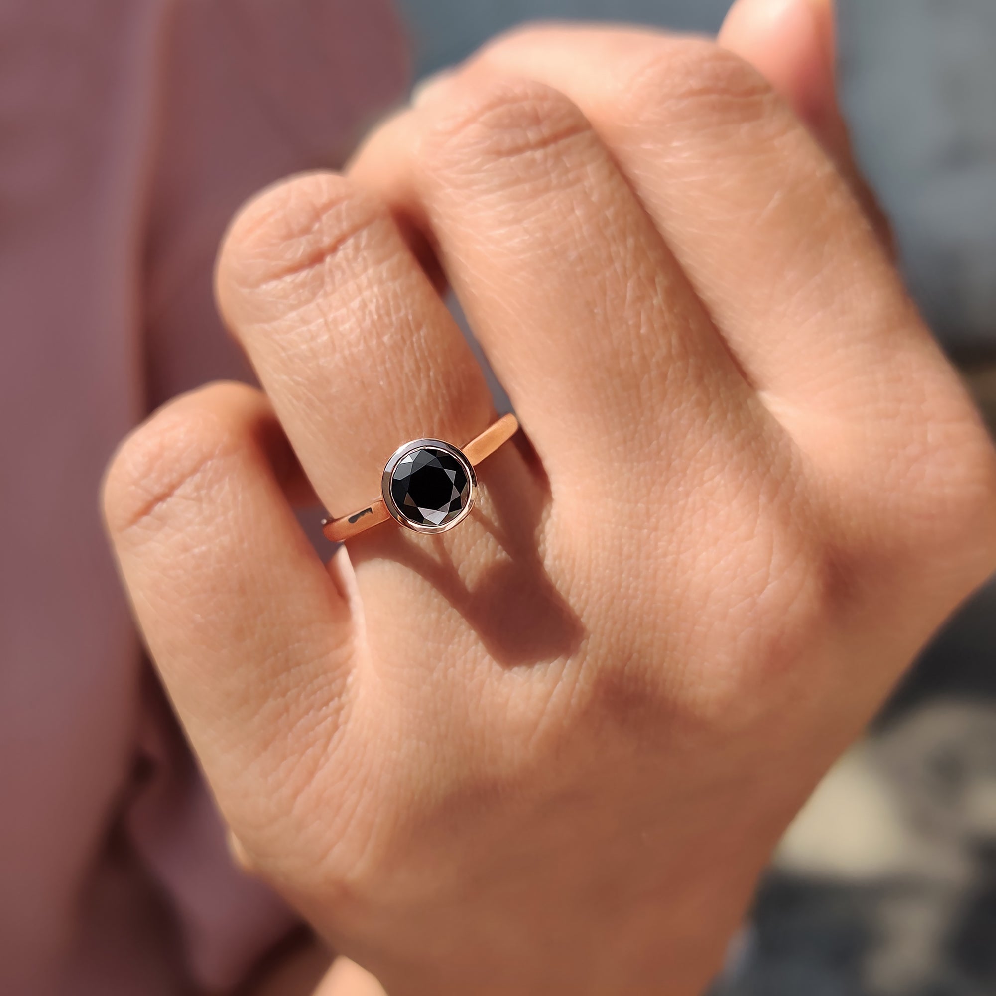 Proposal ring with custom engagement ring design in rose gold and black Moissanite.
