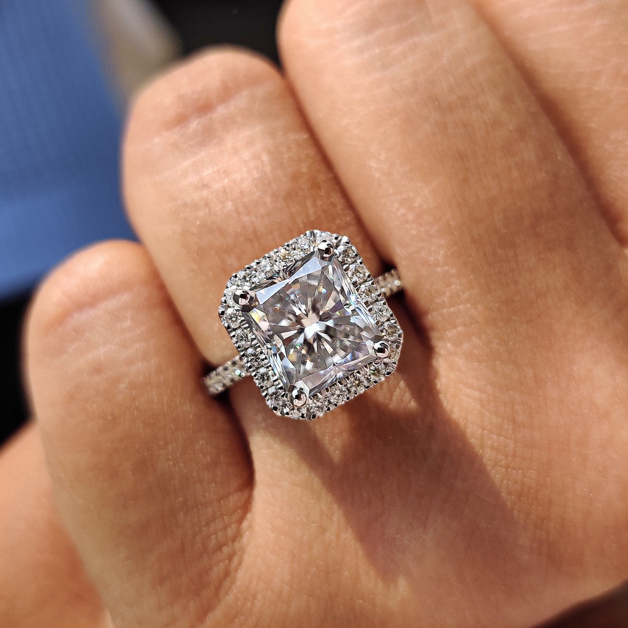 Radiant moissanite gleams with fire and graceful charm.