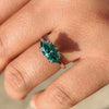 Green marquise ring with double claw prong setting