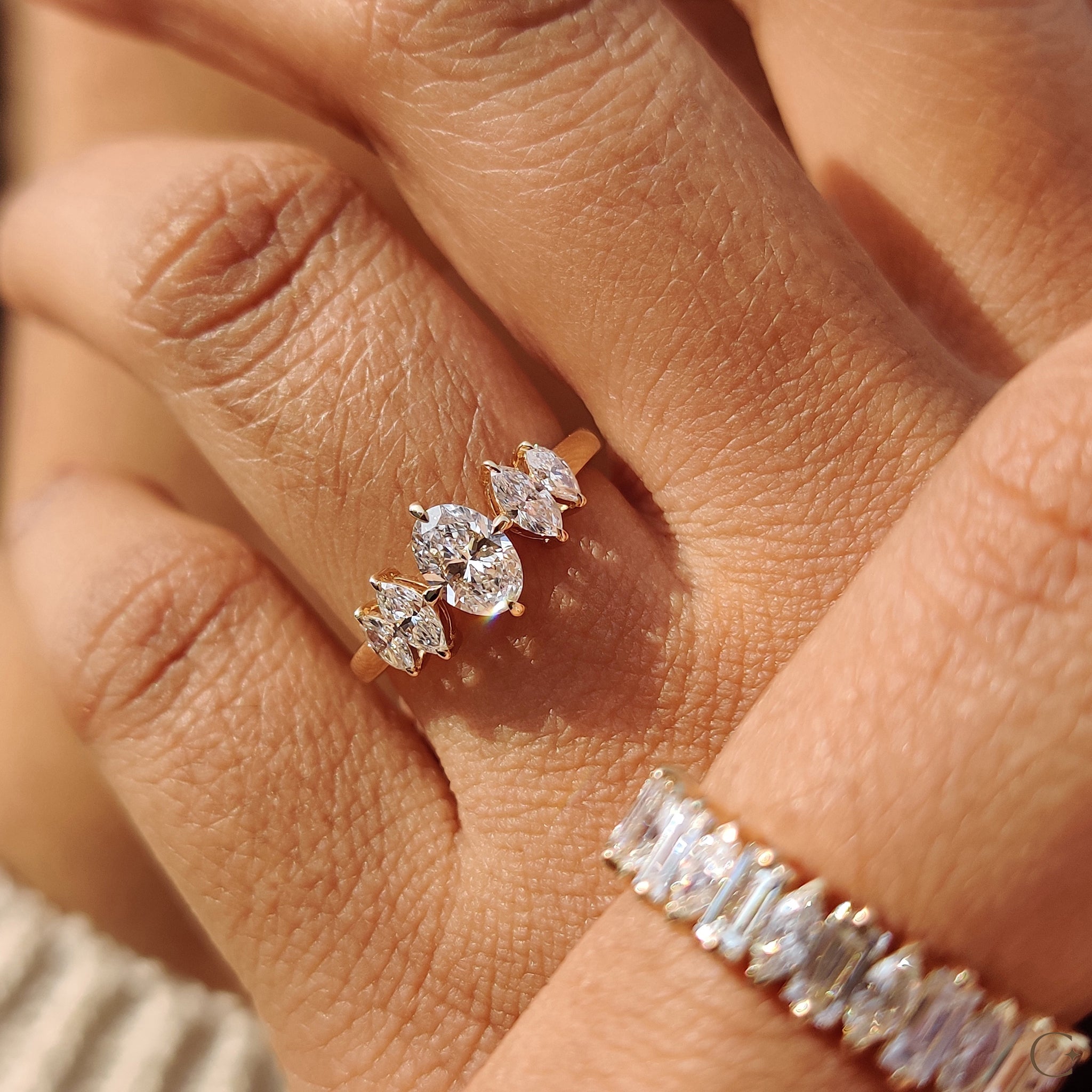 Handmade ring with marquise and oval diamonds.

