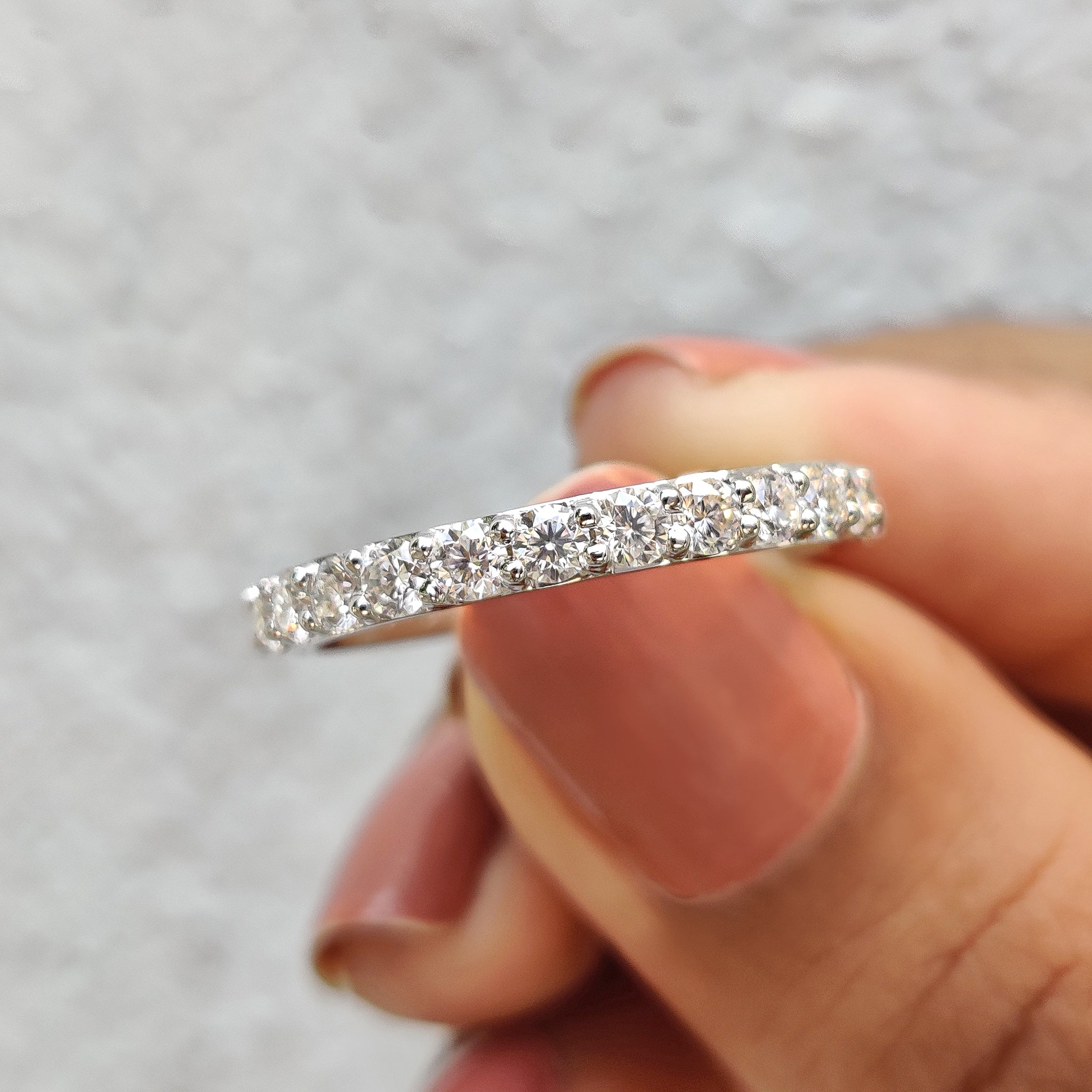 Moissanite eternity band with round cut wedding band.