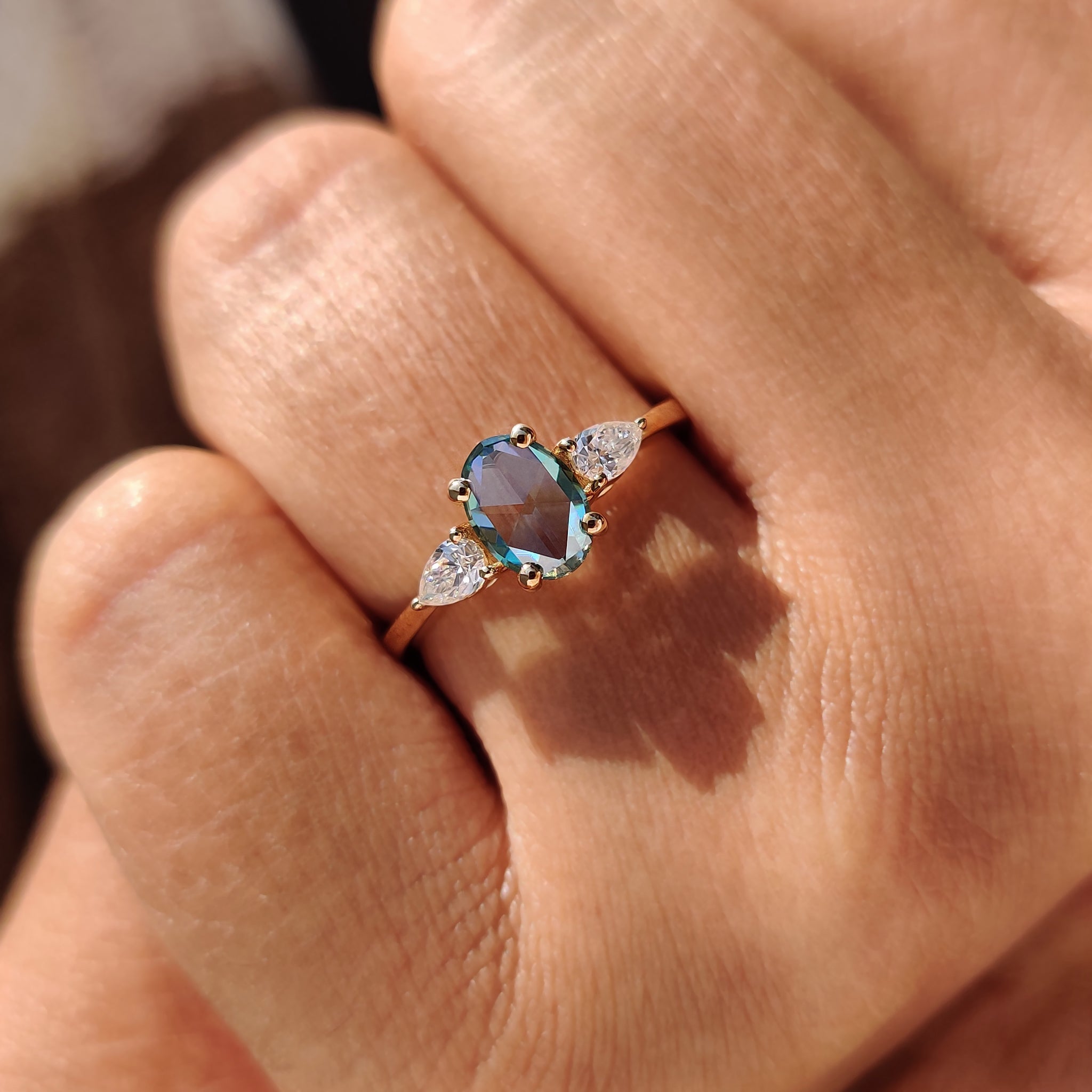 Proposal ring with oval and pear Moissanite stones in yellow gold