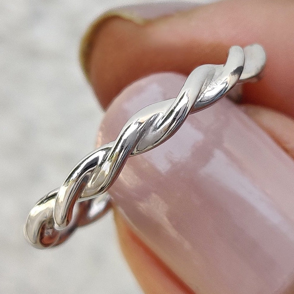 The twisted wedding band pairs perfectly with the white gold wedding band.
