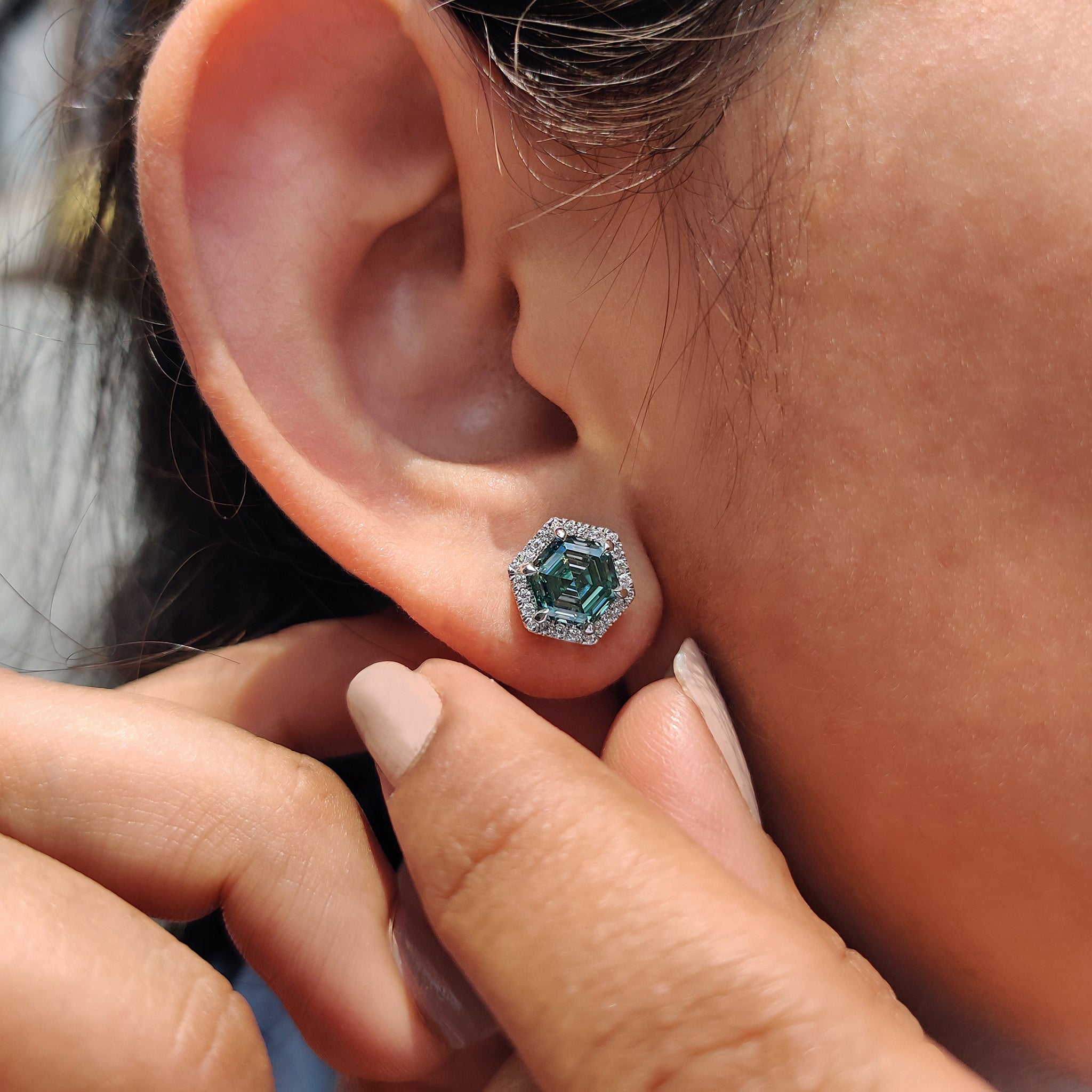 Earrings made with Hexagon Step cut Cyan Blue Moissanite in handmade earrings finish.
