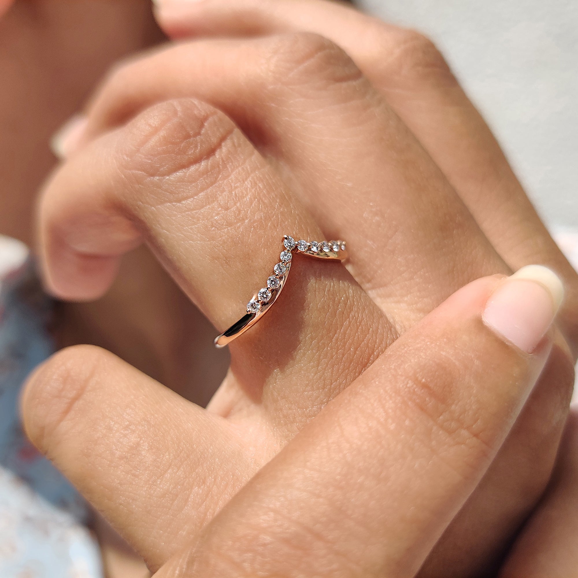 Carat Diamonds band with chevron shape and round moissanite.