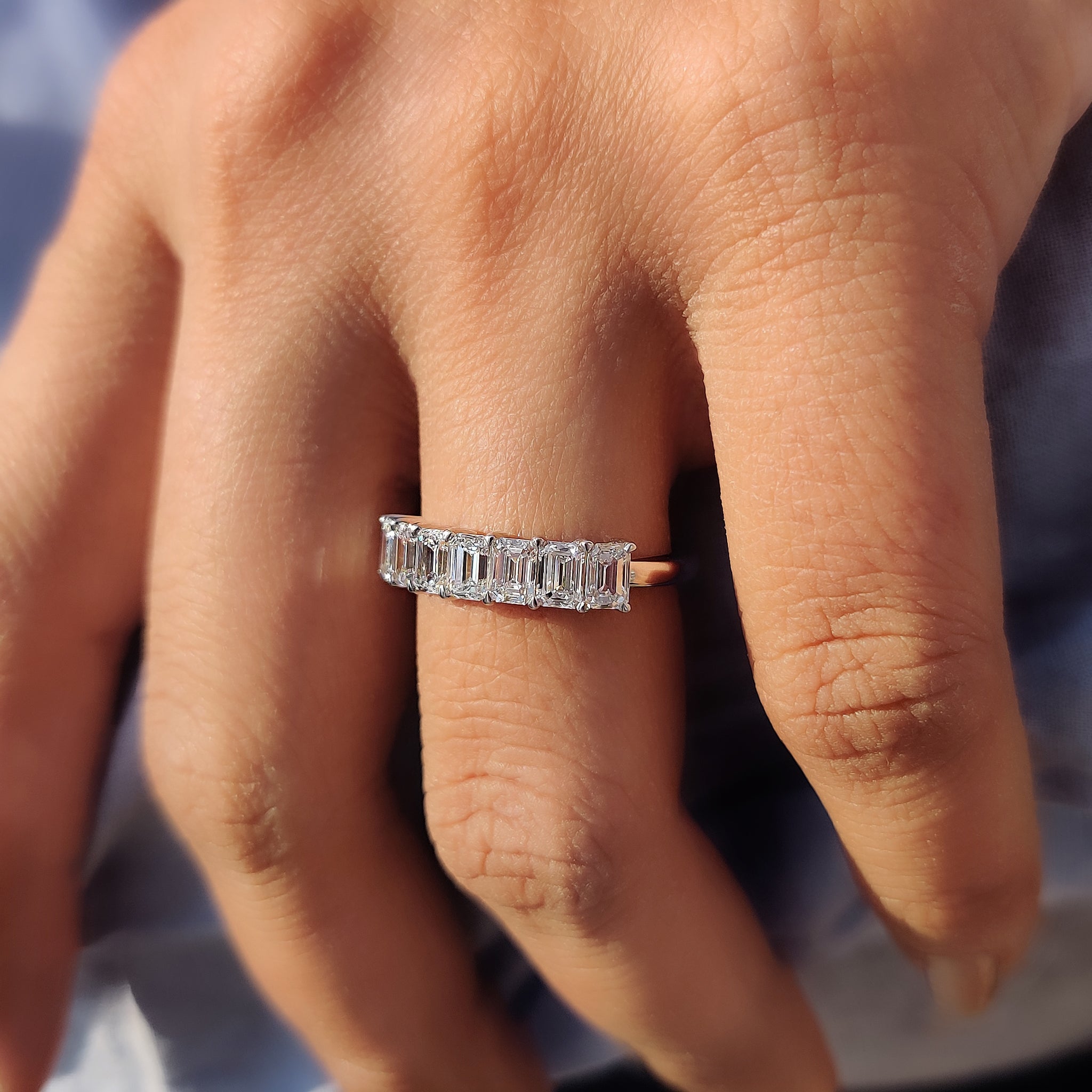 Carat Diamonds band featuring seven stunning prong set stones.
