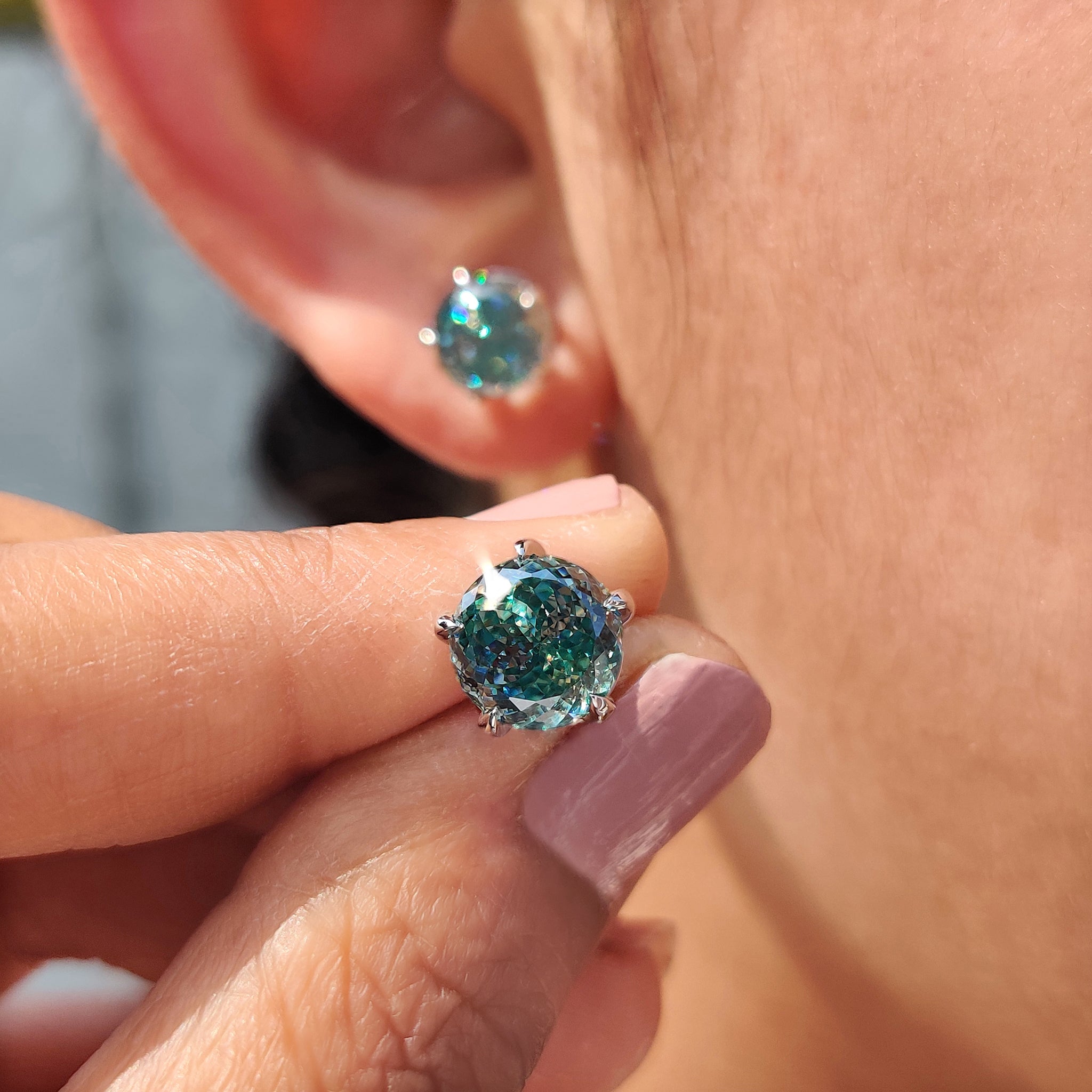 5 prong claw setting used in Portuguese cut earrings with Cyan Blue Stud Earrings.
