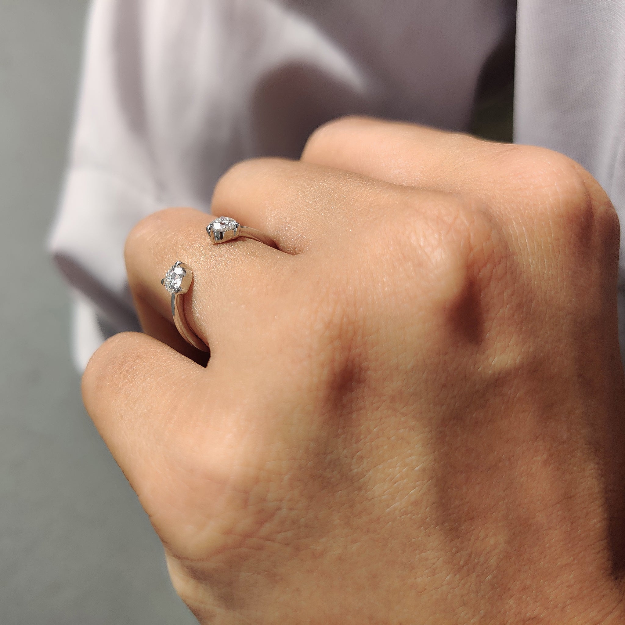 Custom wedding band with a modern open gap and dual placement.
