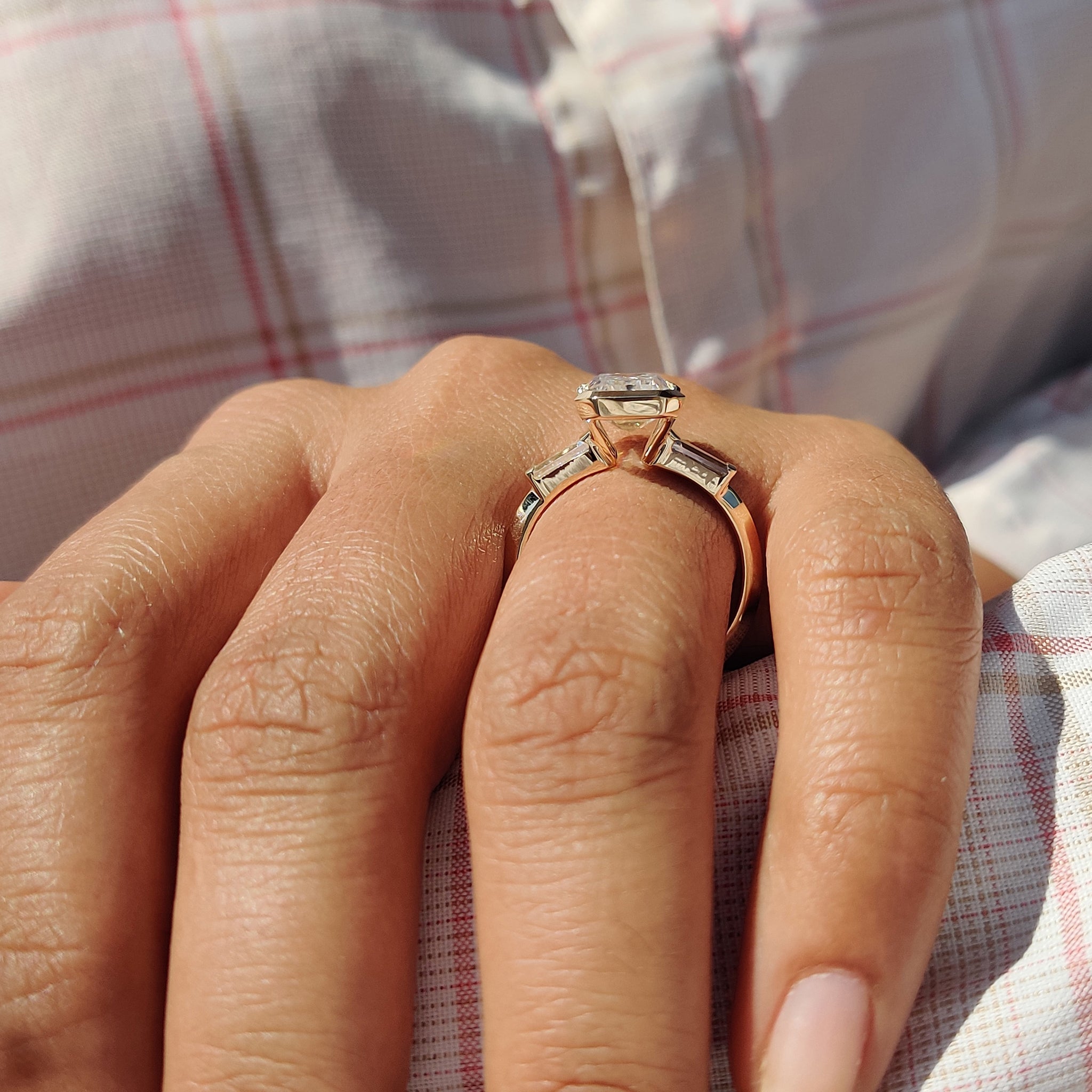 Proposal ring with emerald cut and tapered baguette stones