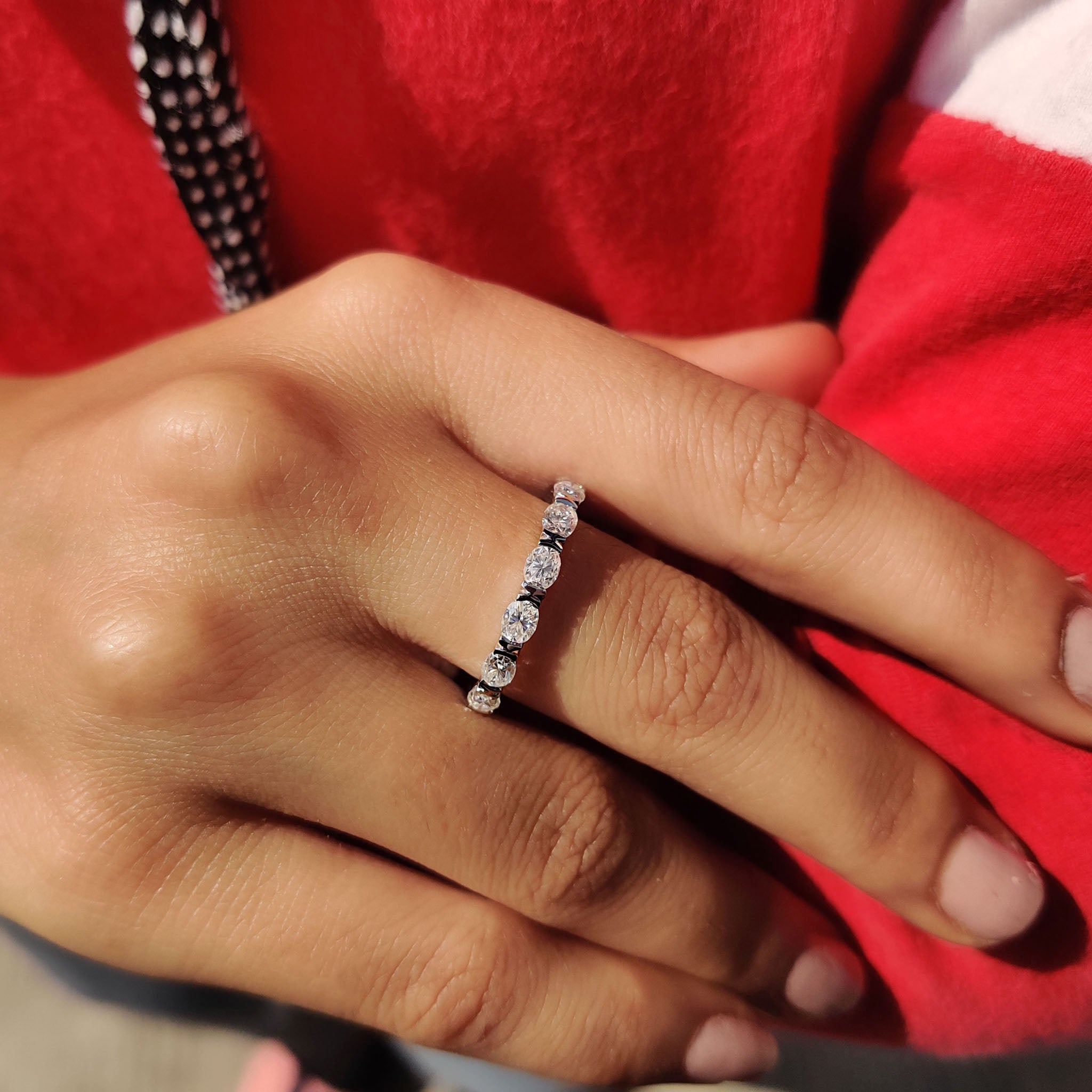 Moissanite full eternity band designed for maximum brilliance with stones encircling the entire band.