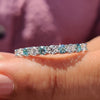 Buy moissanite band with full eternity design, perfect for showcasing round cut stones in a prong set arrangement.