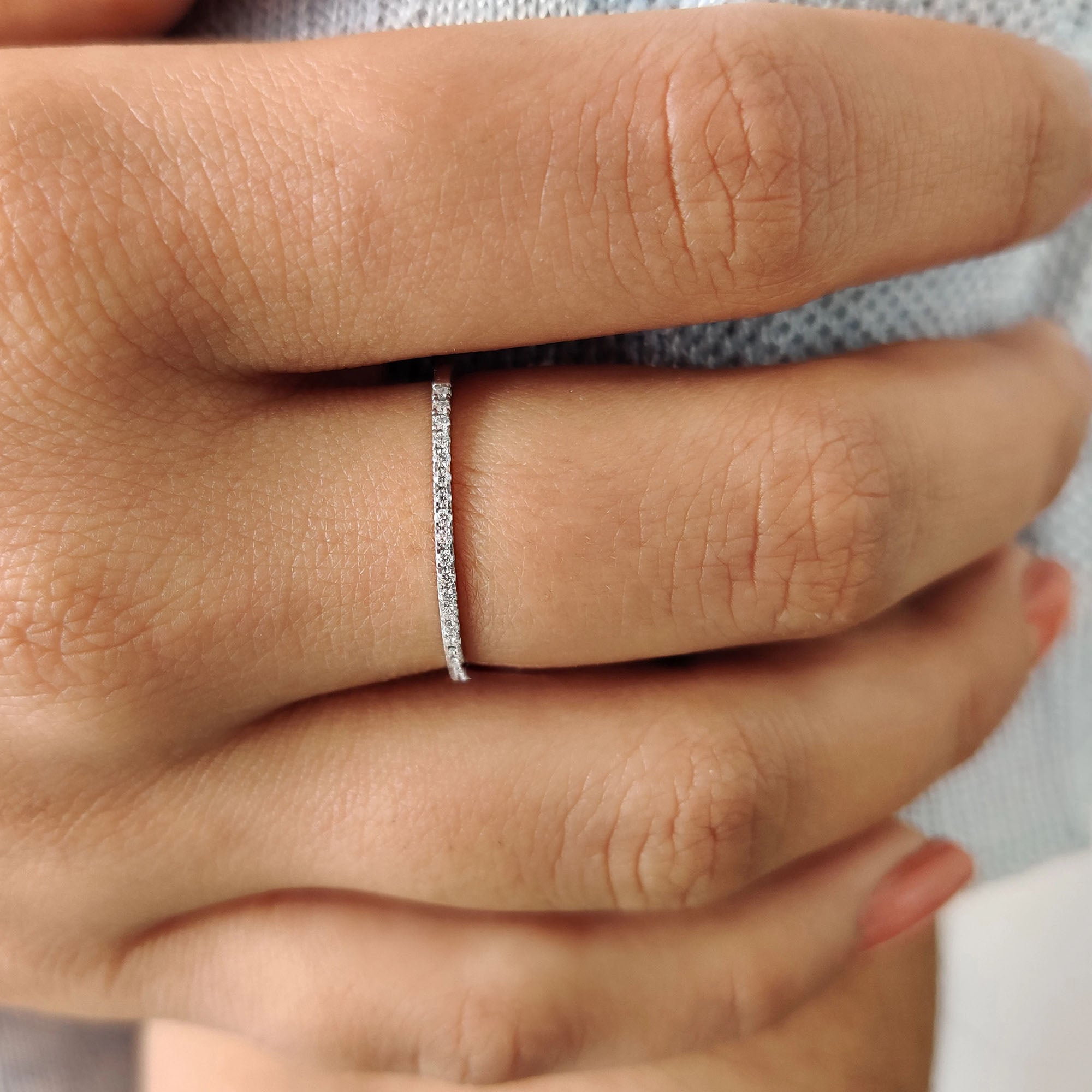 Delicate round cut eternity band with a continuous sparkle.
