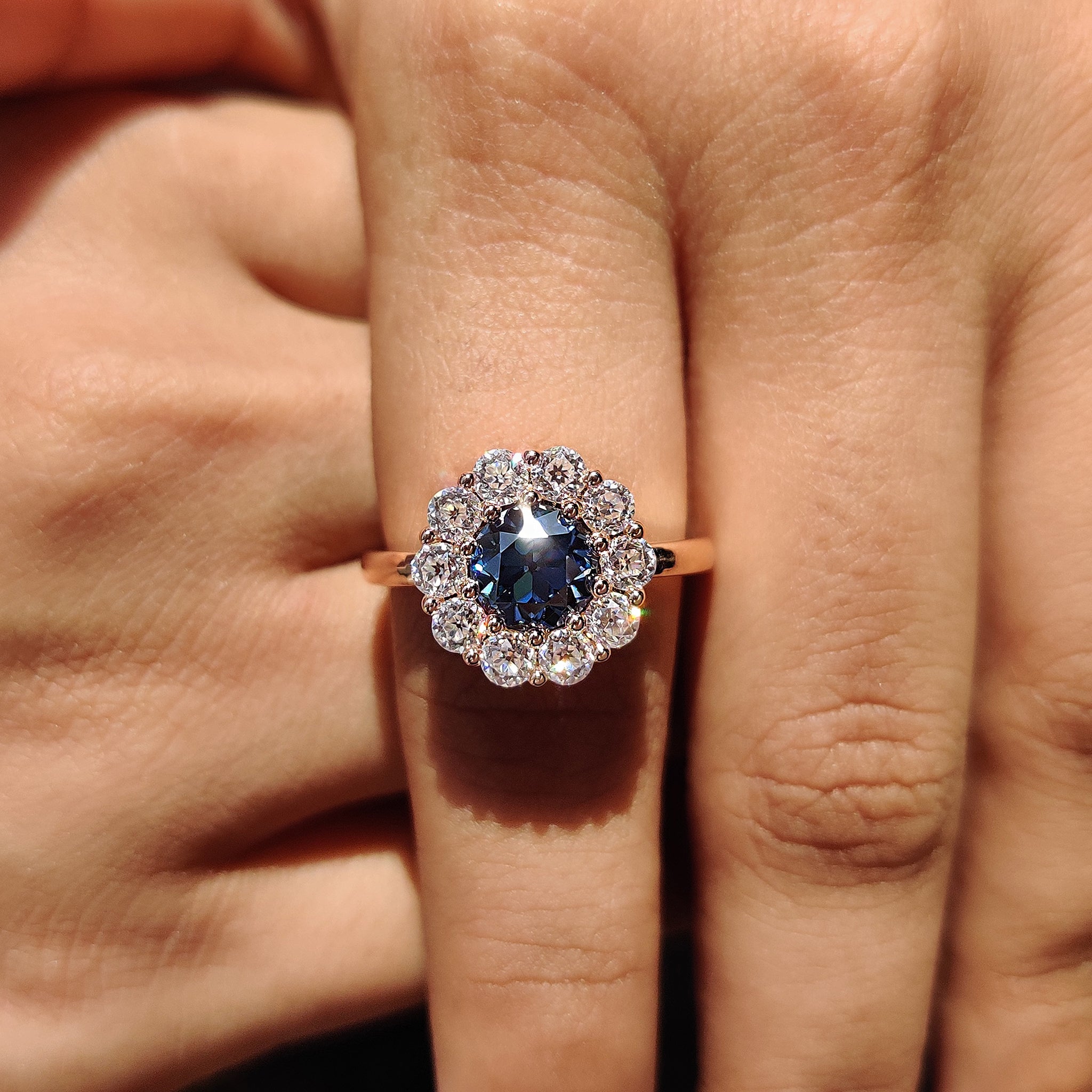 Round cut halo style ring with brilliant moissanite stones for a modern twist.
