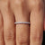 White gold eternity band with handmade jewelry.
