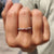 Half eternity moissanite wedding band in white gold
