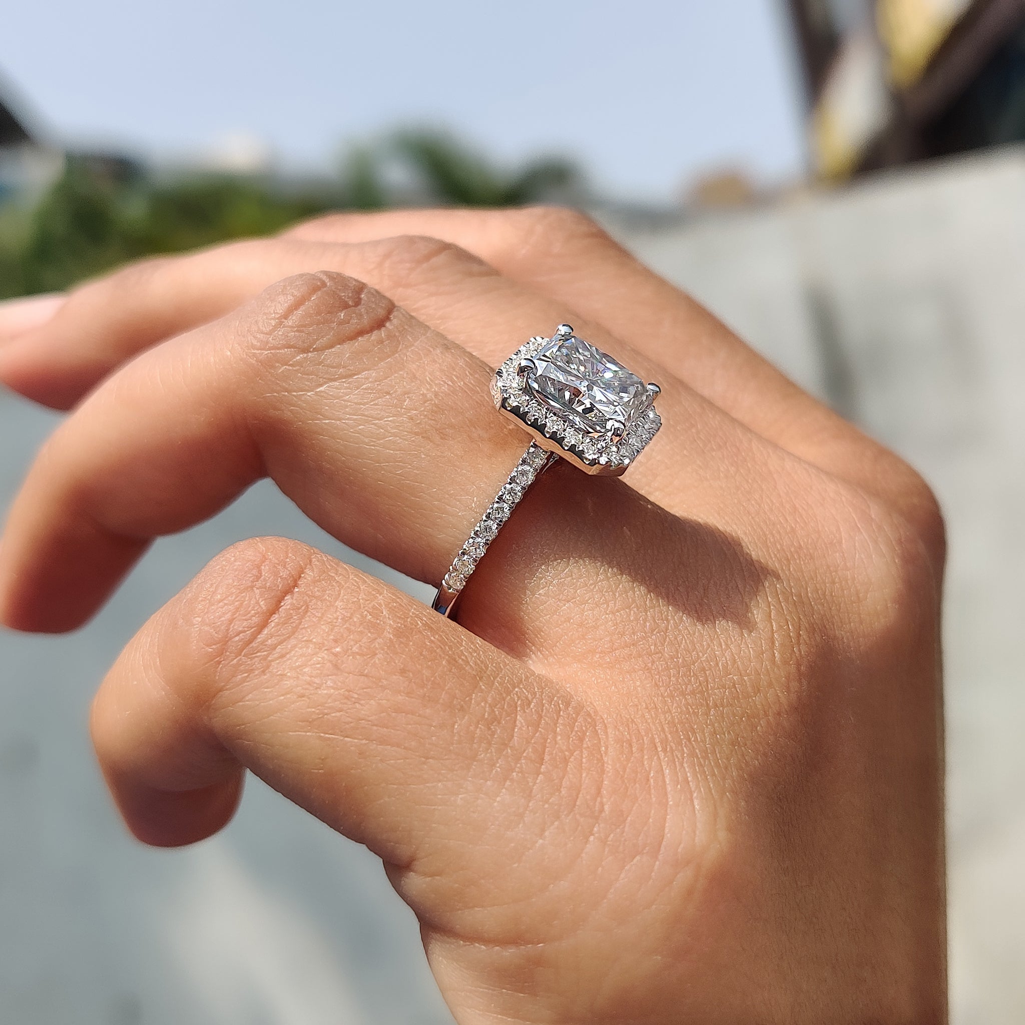 Round moissanite set captures light in every fine line.