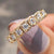 The half eternity band is designed halfway around.