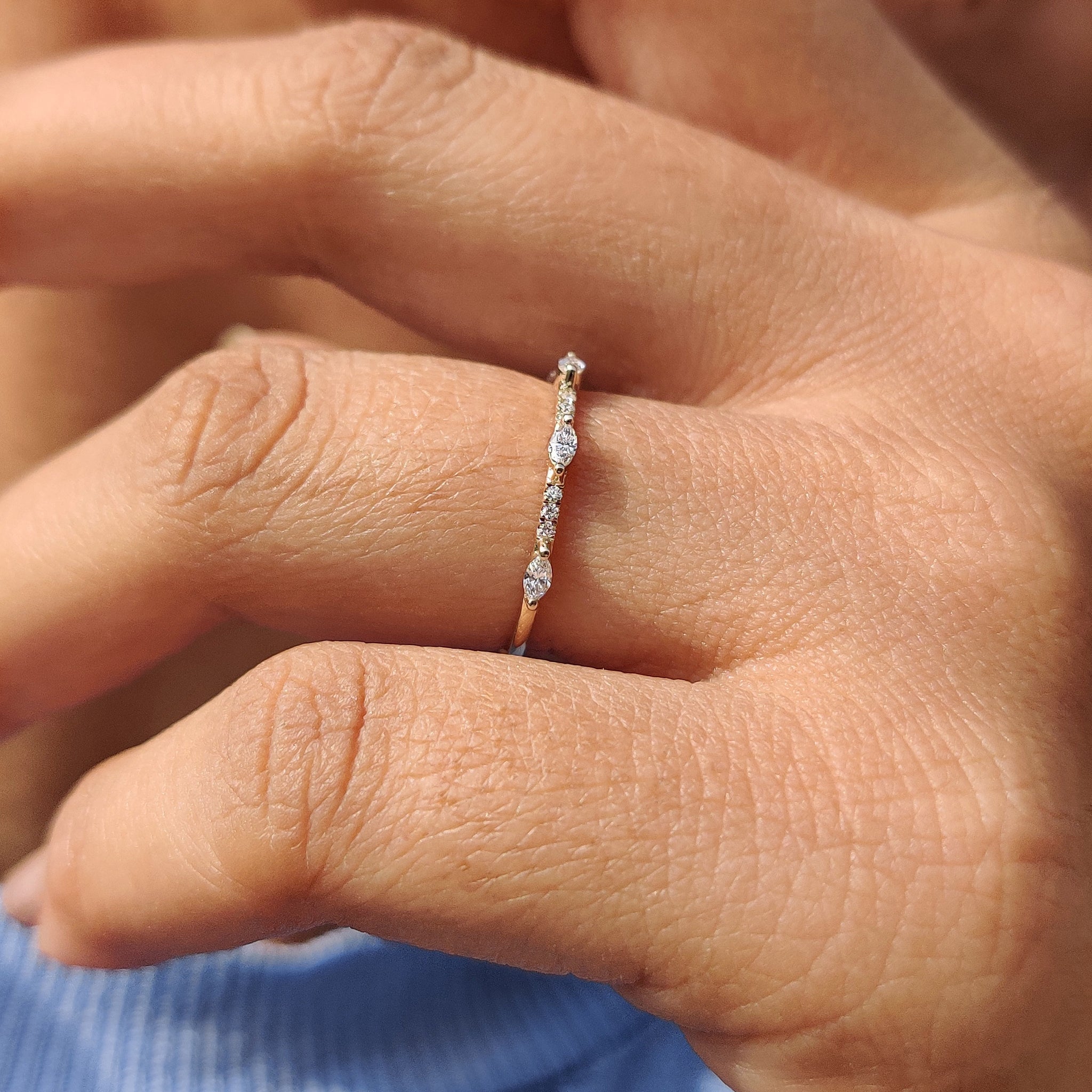 Half eternity diamond band featuring a continuous row of diamonds.
