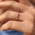 Half eternity diamond band featuring a continuous row of diamonds.
