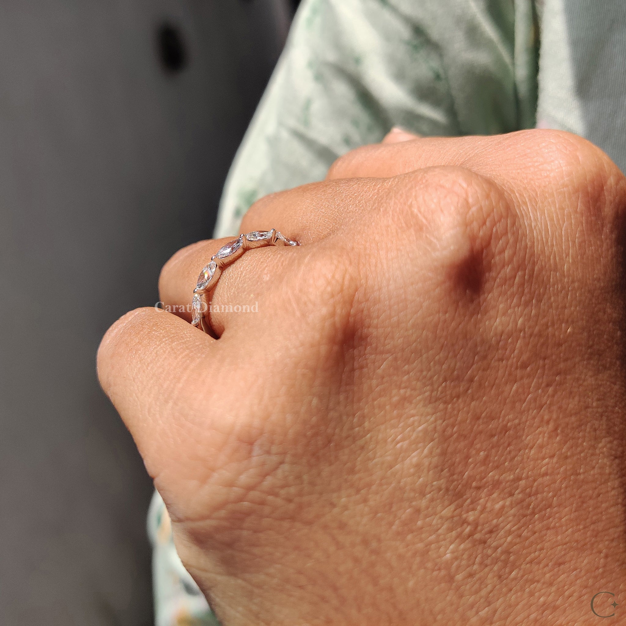 Five marquise diamonds set in a stunning wedding band.
