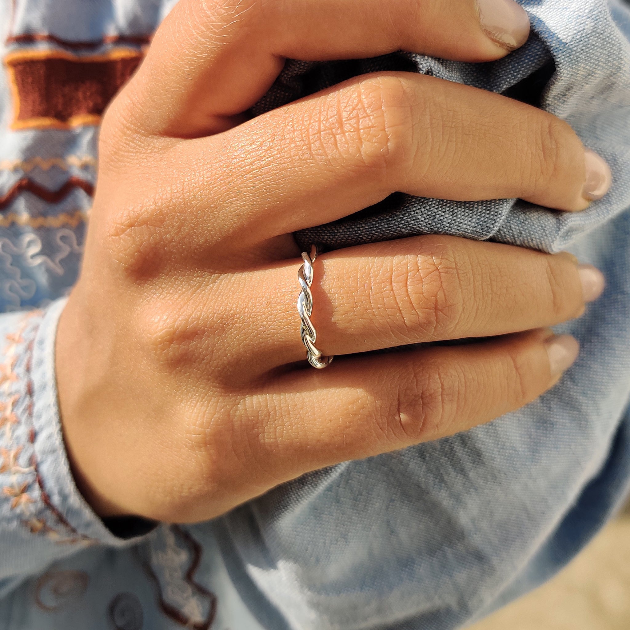 A simple wedding band pairs well with handmade jewelry for a timeless look.
