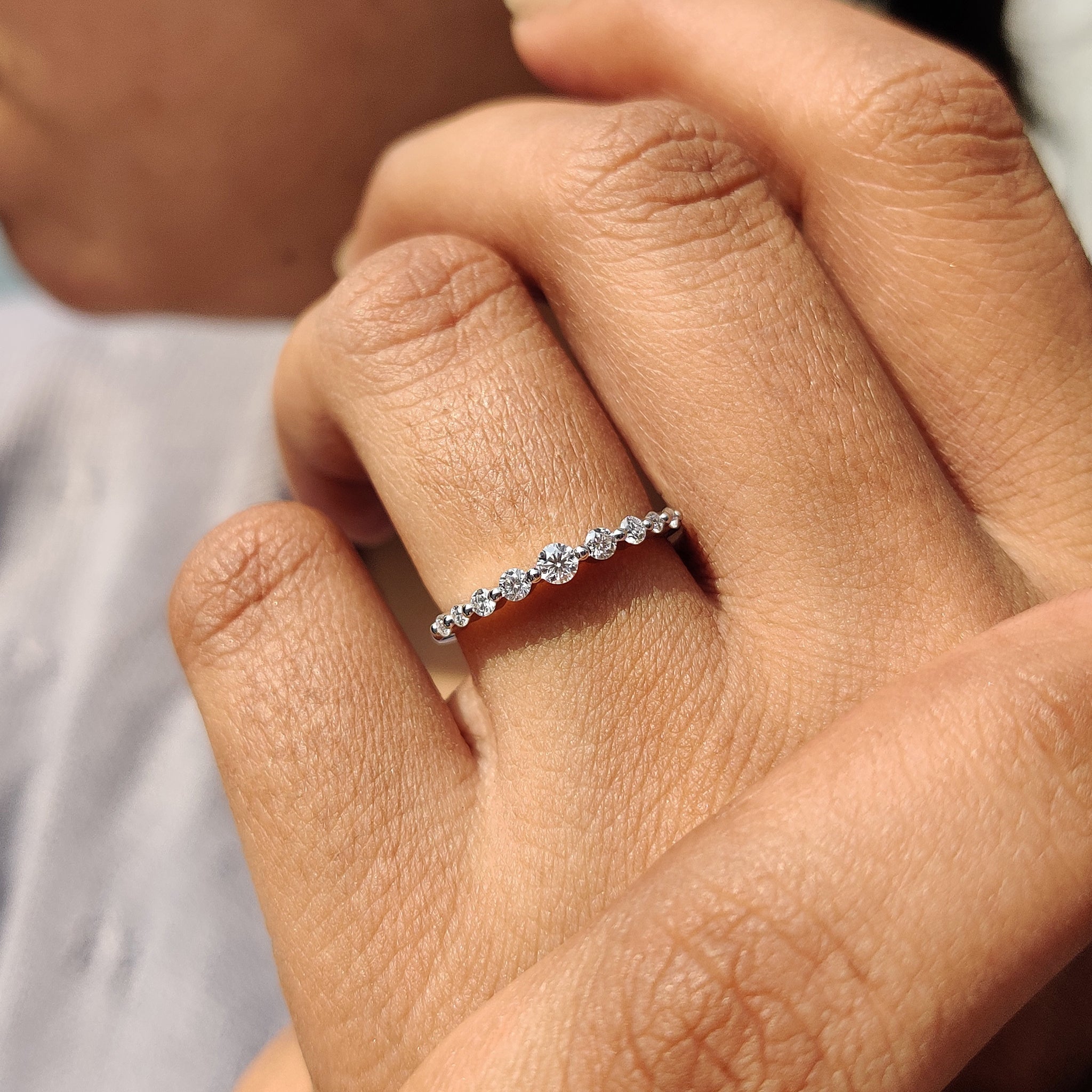 Handmade diamond band with shared prongs.
