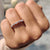 Prong set wedding band handcrafted for lasting brilliance.
