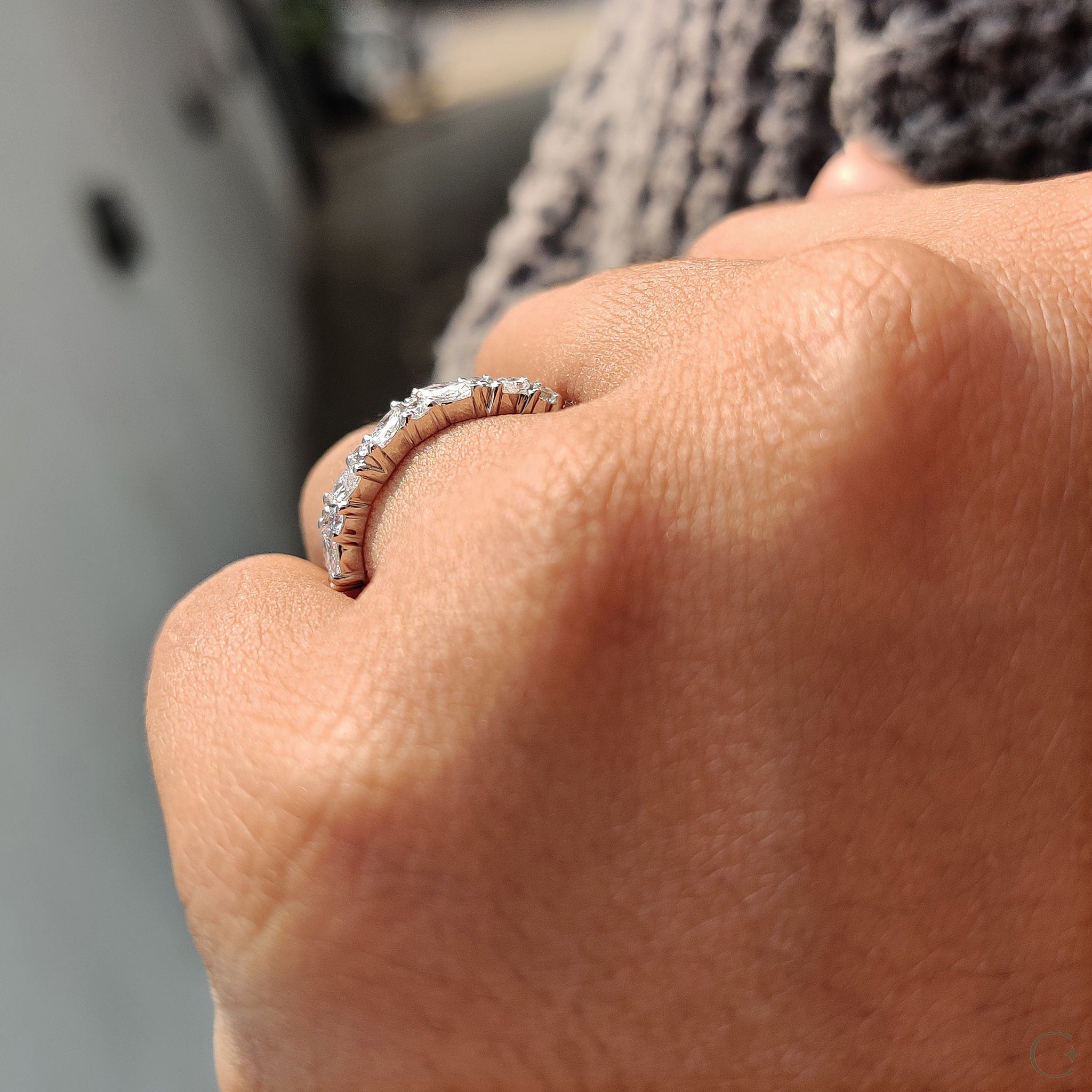 Custom wedding band with marquise and round diamonds.
