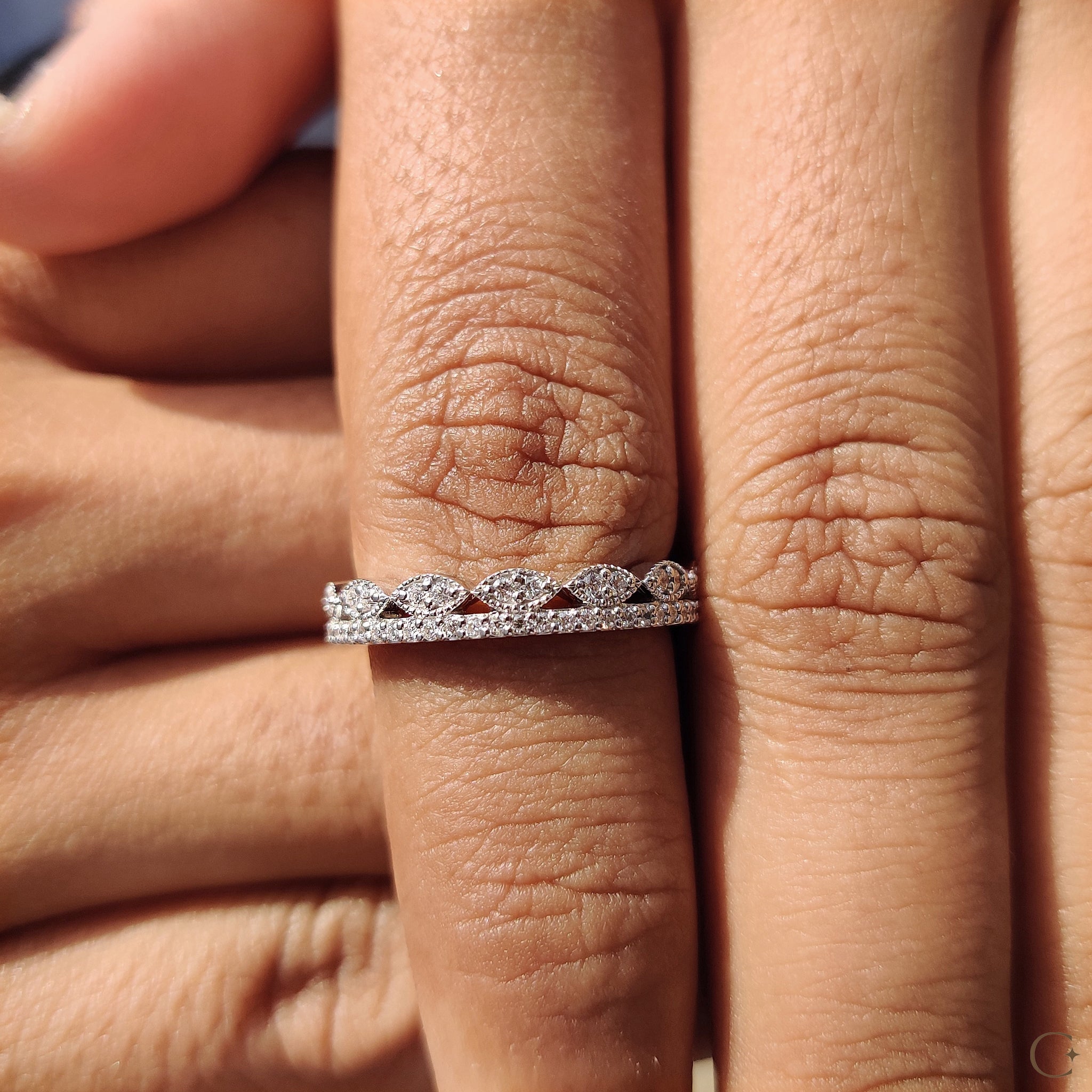 Carat Diamonds wedding band with elegant design.
