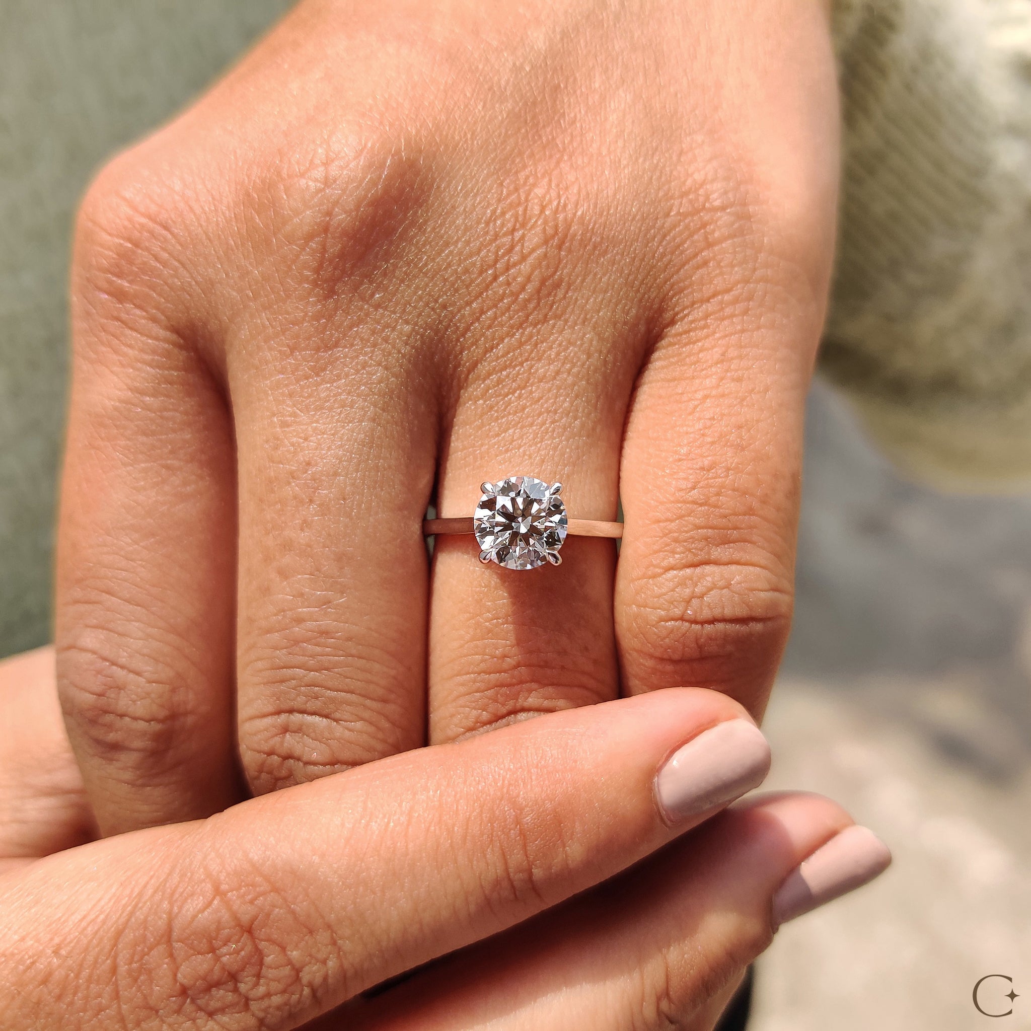 Solitaire setting ring showcasing a sparkling round diamond.
