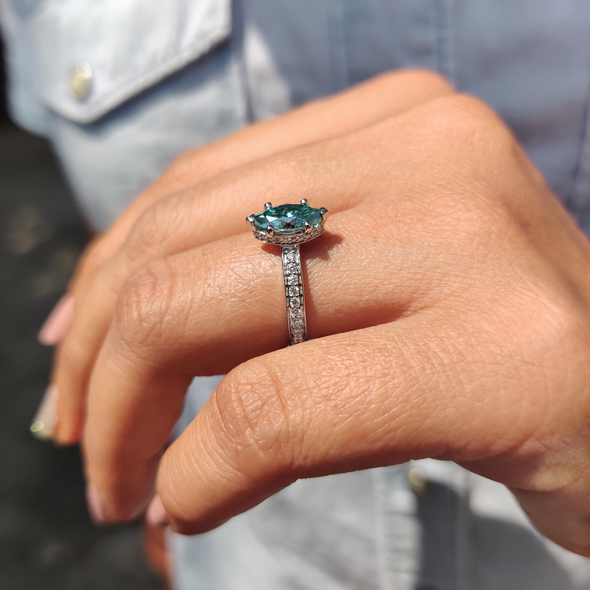Cyan blue marquise cut moissanite ring set in a beautiful white gold band.