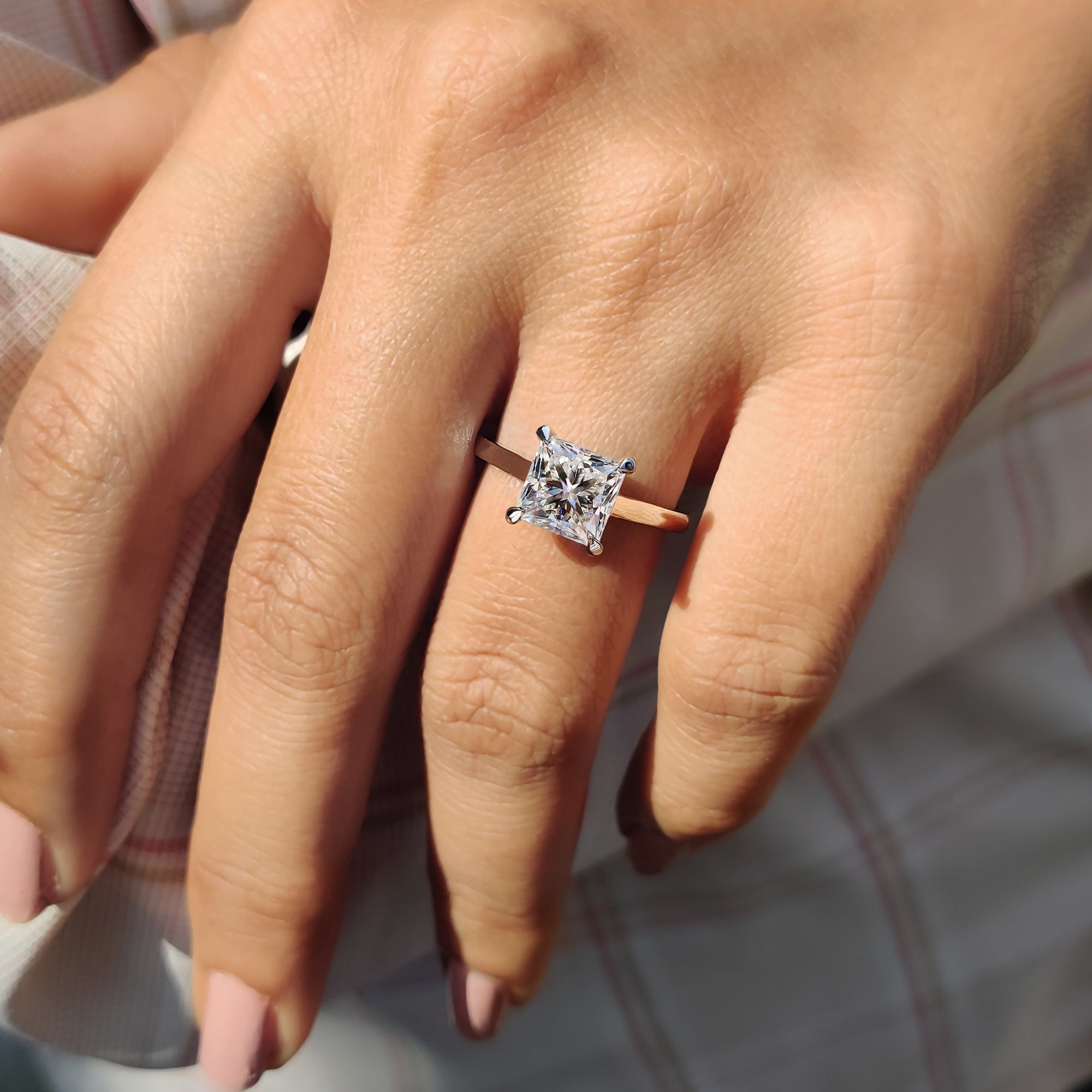 Moissanite engagement ring handcrafted in white gold, perfect for romantic proposals.
