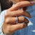 Elegant white gold band showcasing the beauty of round moissanite stones.