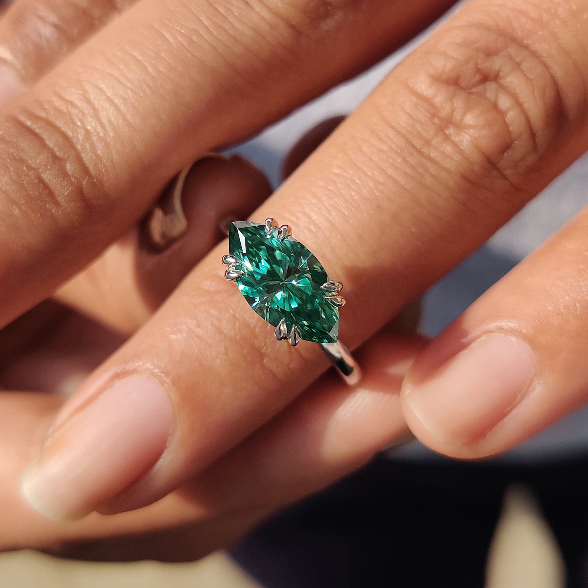 Carat Diamonds engagement ring with marquise cut Moissanite