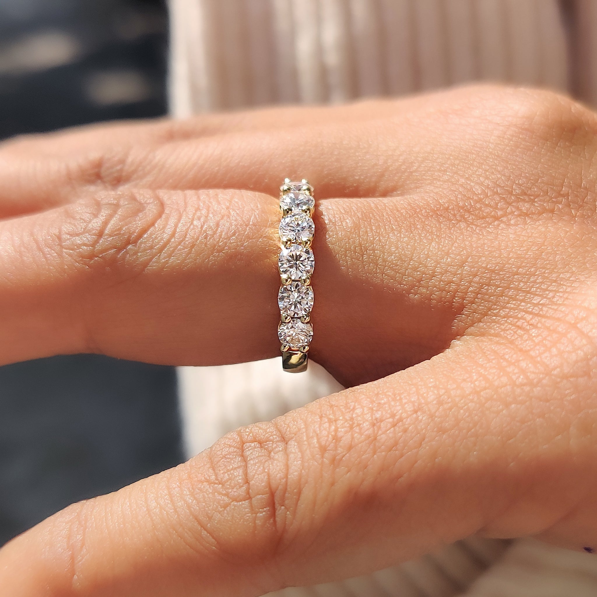 Elegant round diamond half eternity band for weddings.
