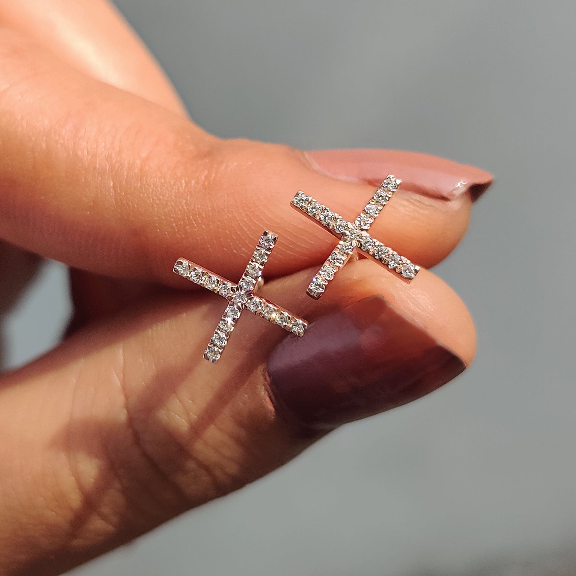 Rose gold earrings used in X shaped stud earrings and Moissanite Earrings collection.

