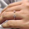 Open gap wedding band featuring two round cut  stones in a modern prong setting.
