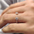 Open gap wedding band featuring two round cut  stones in a modern prong setting.
